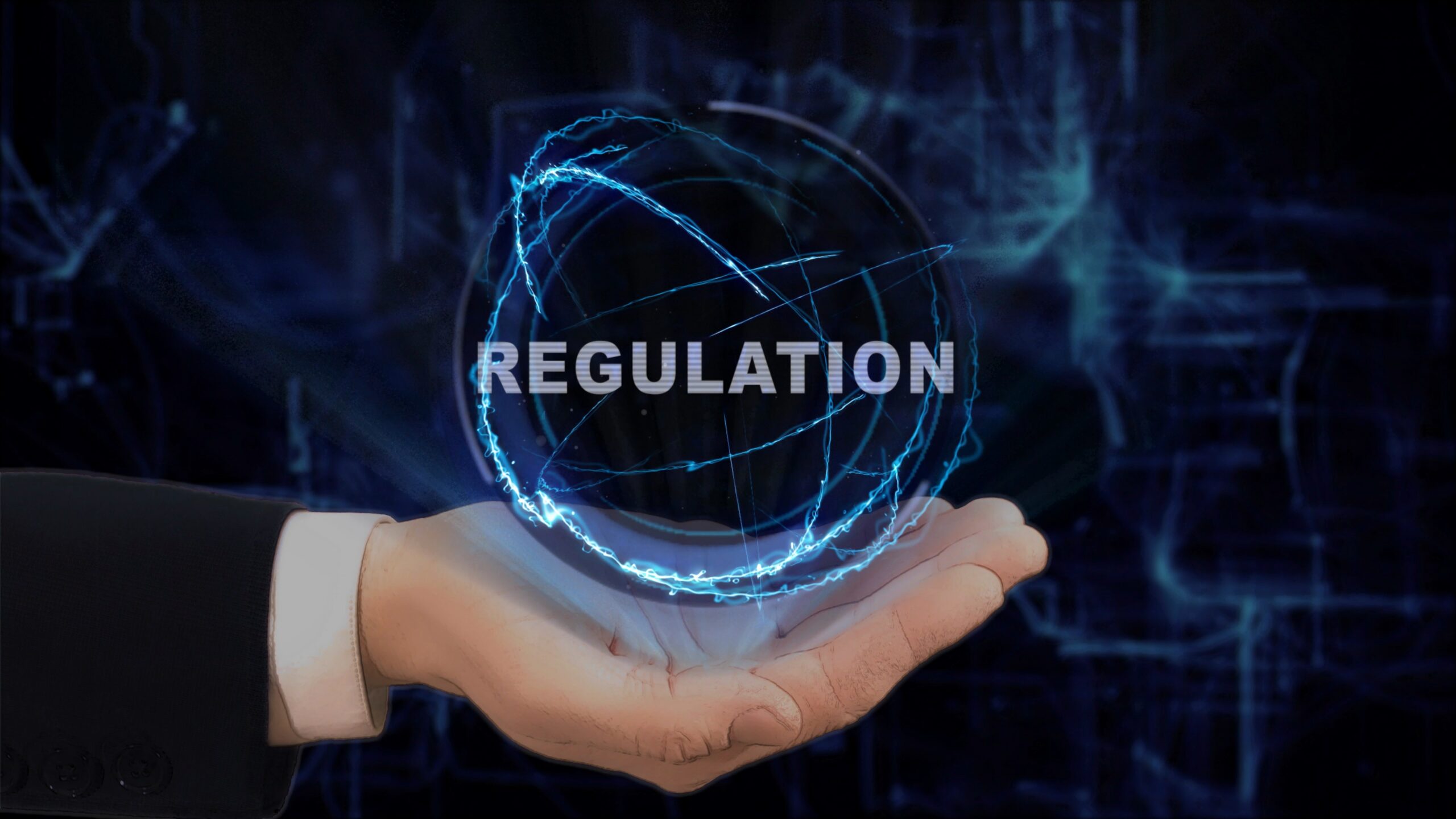 Painted hand shows concept hologram Regulation on his hand. Drawn man in business suit with future technology screen and modern cosmic background